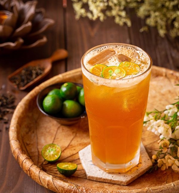 A glass of kumquat honey tea