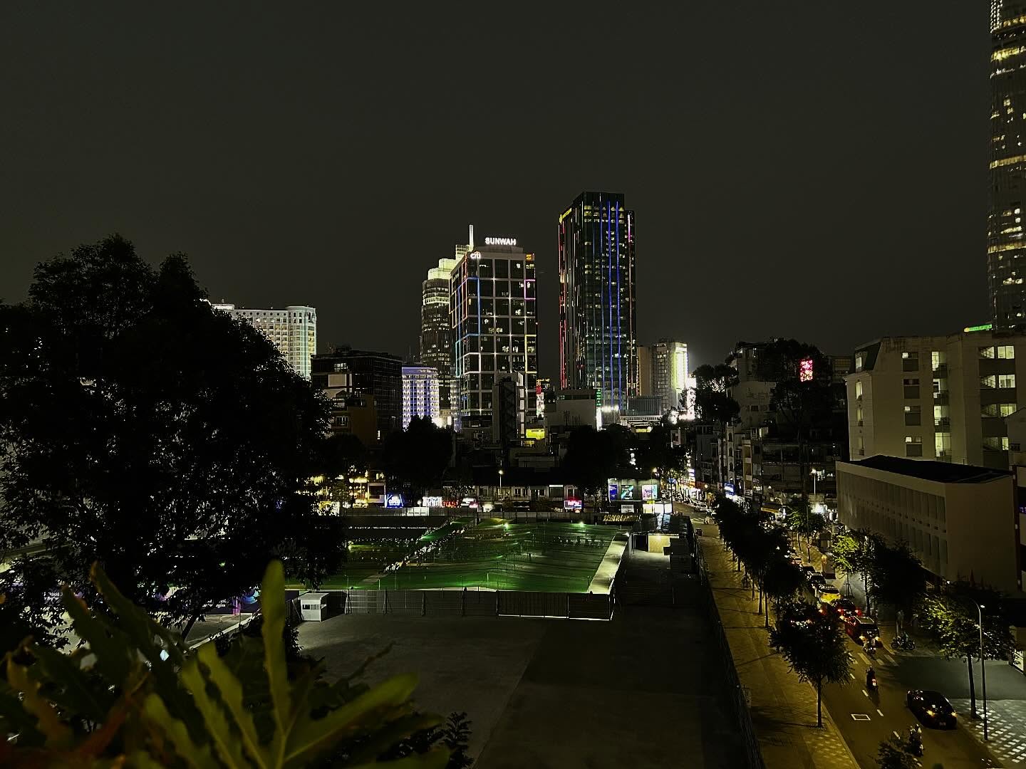 Saigon's night streets seen from the venue rooftop