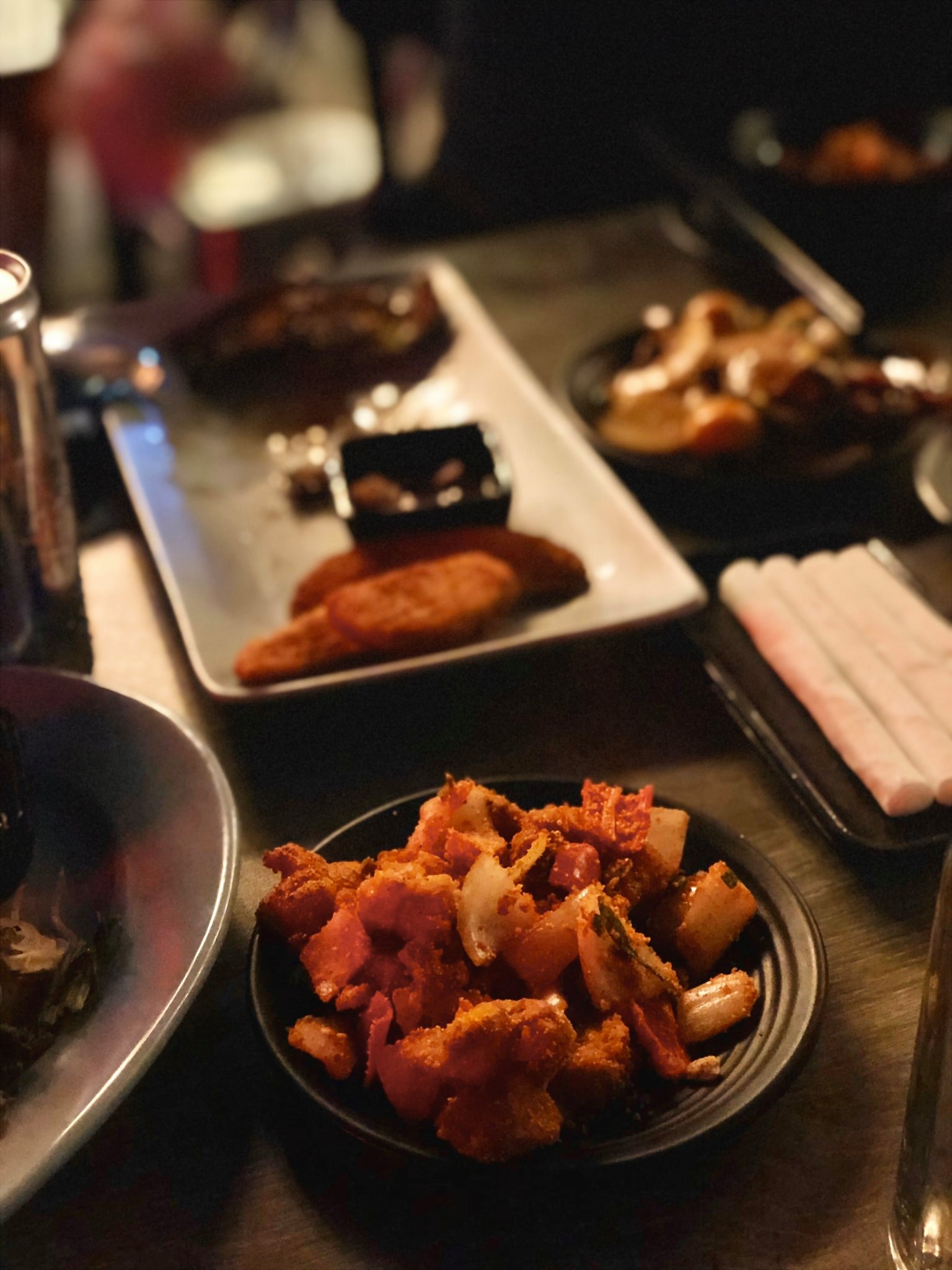 An evening table of grill bites and beer at Ba Gac
