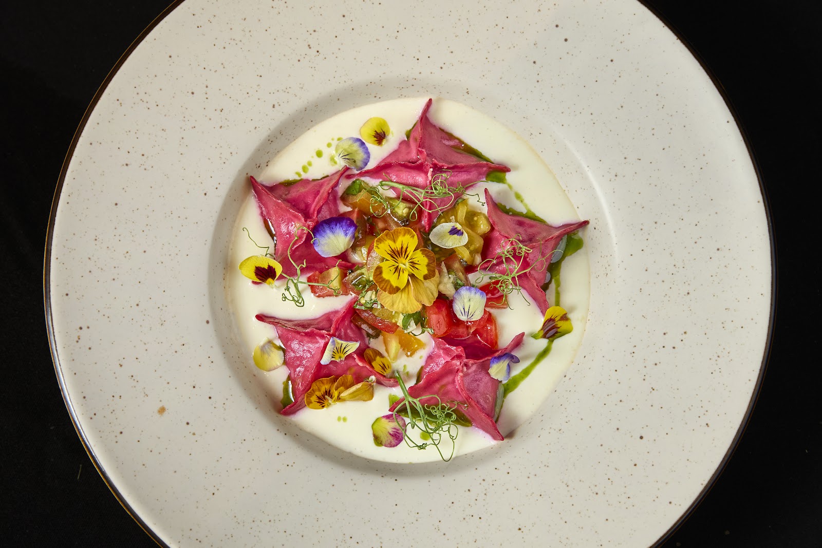 Beet ravioli under hard light