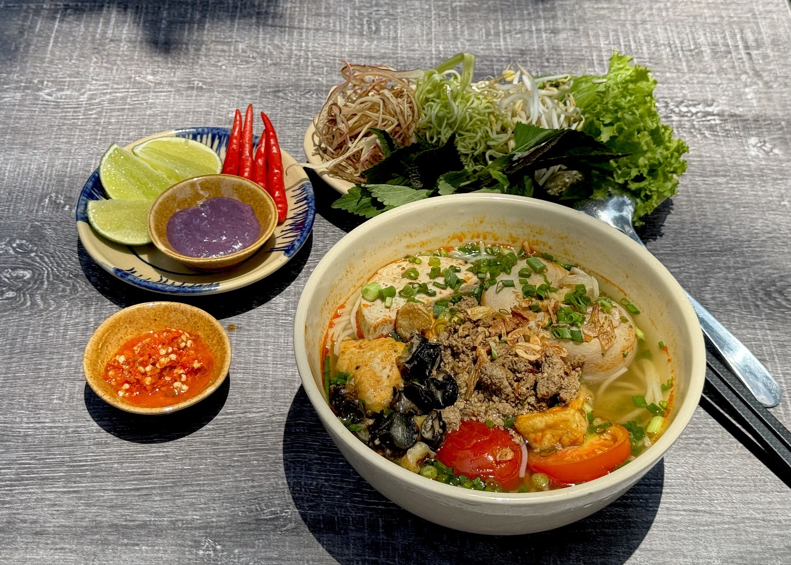 The steaming Bún Riêu Nhà field-crab bún riêu bowl (pending the venue photo pass)