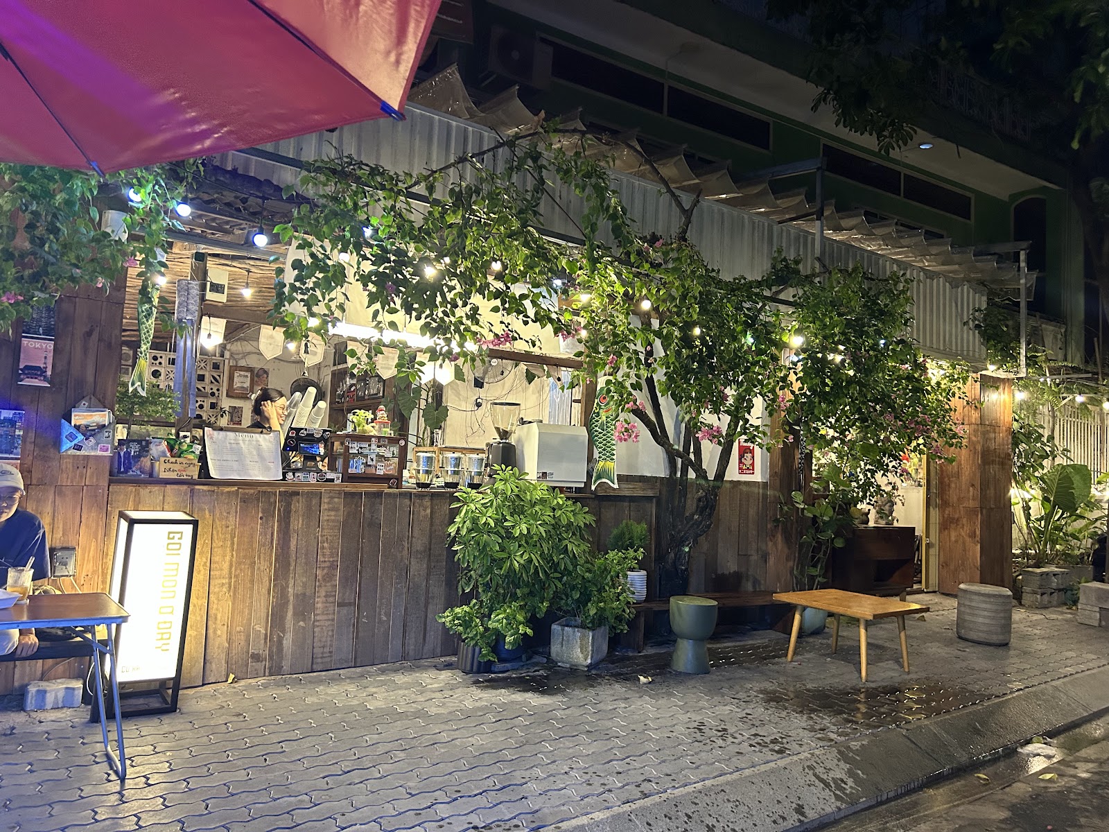 CƯ XÁ — the bar at night, warm bulb lights