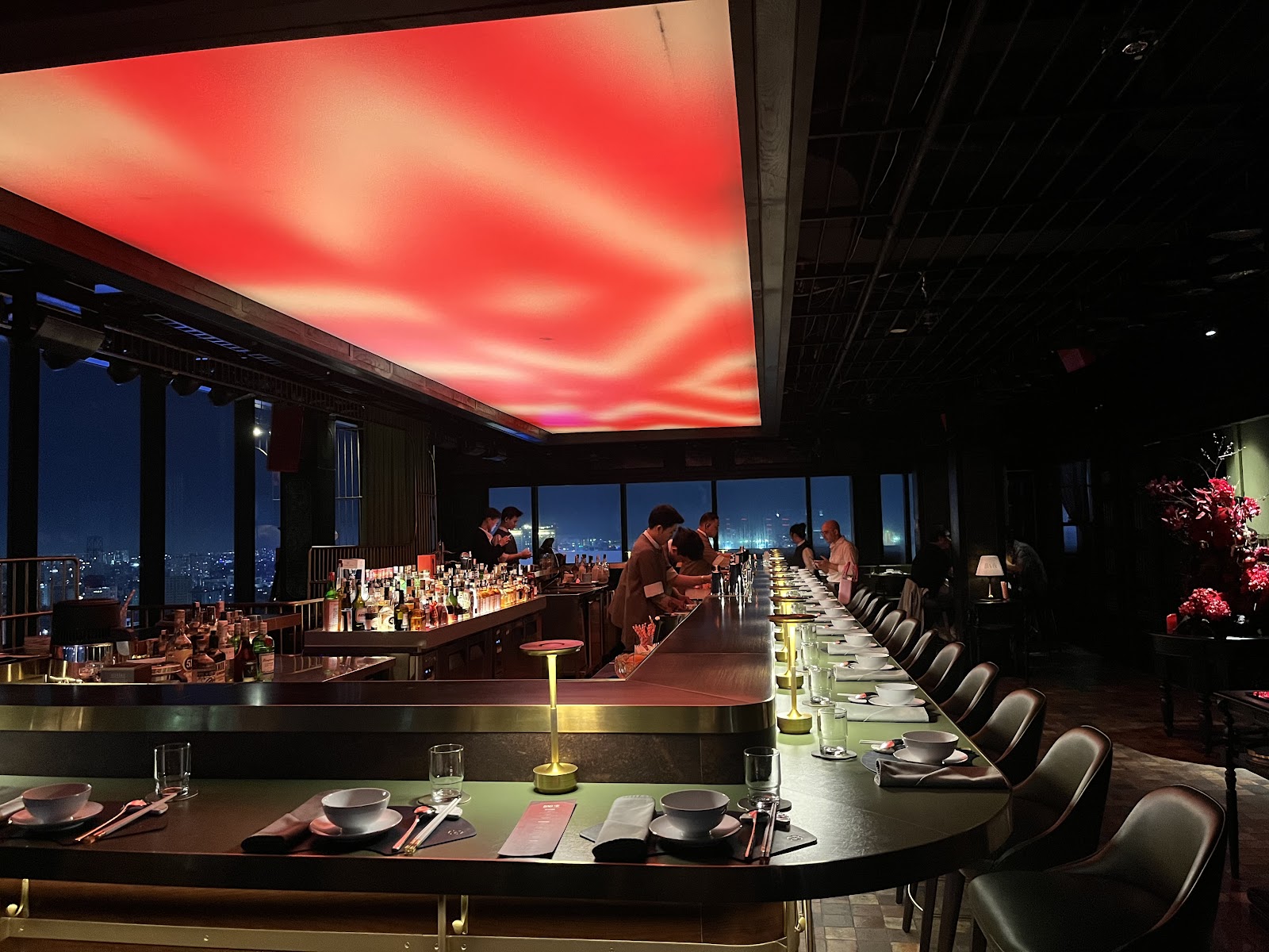 The long curved counter under the red ceiling