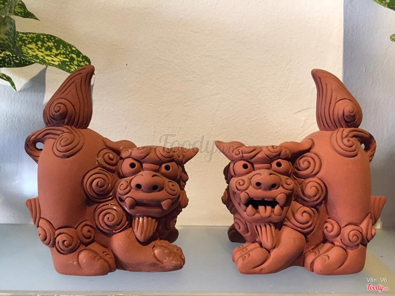 Red ceramic guardian figures arranged with spiritual faith