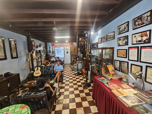 The long hall with white-red checkered tiles and wooden beams