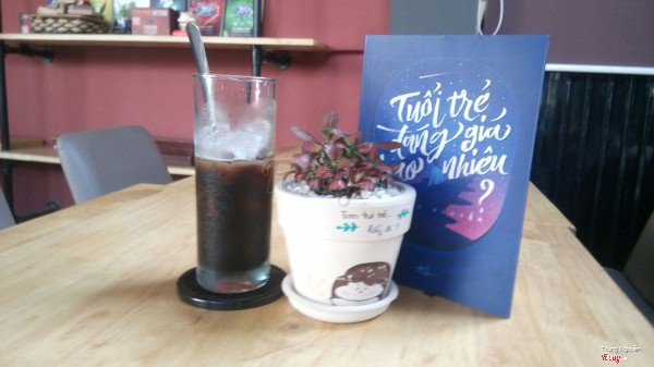 A coffee and a book on the table