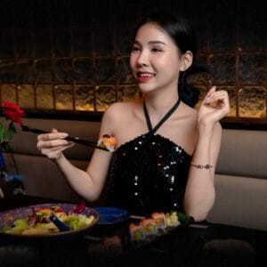 Mayonaka's dark dining room — dark wood booths, black-and-gold walls