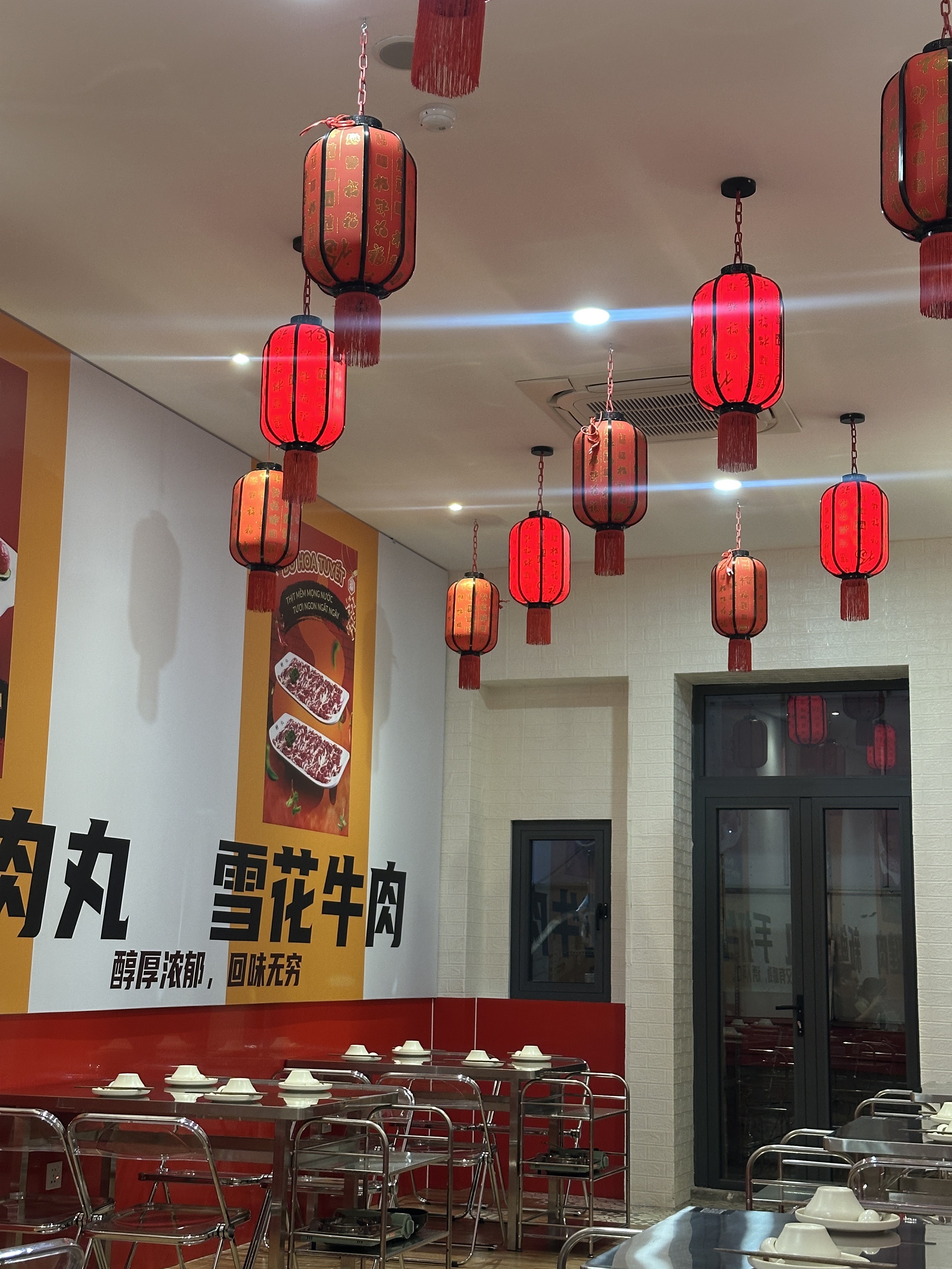 Red lantern glow inside the restaurant