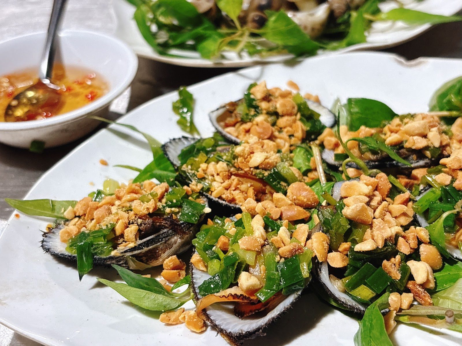 Scallion-oil grilled mussels with peanuts at Oc Nga 111