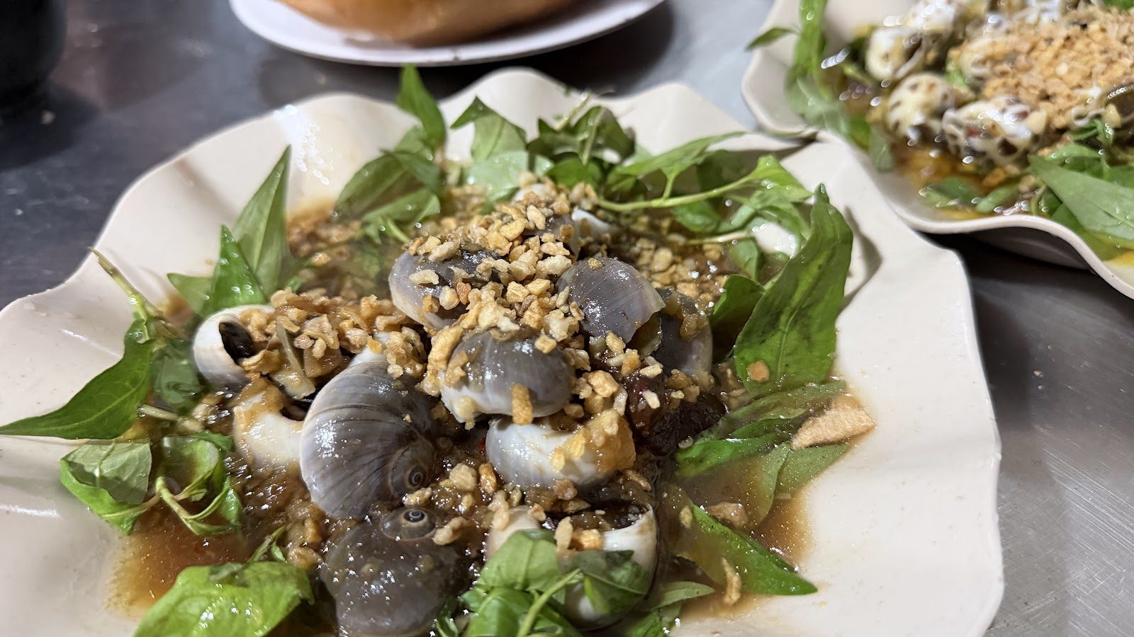 Garlic-tossed snails at Oc Nga 111