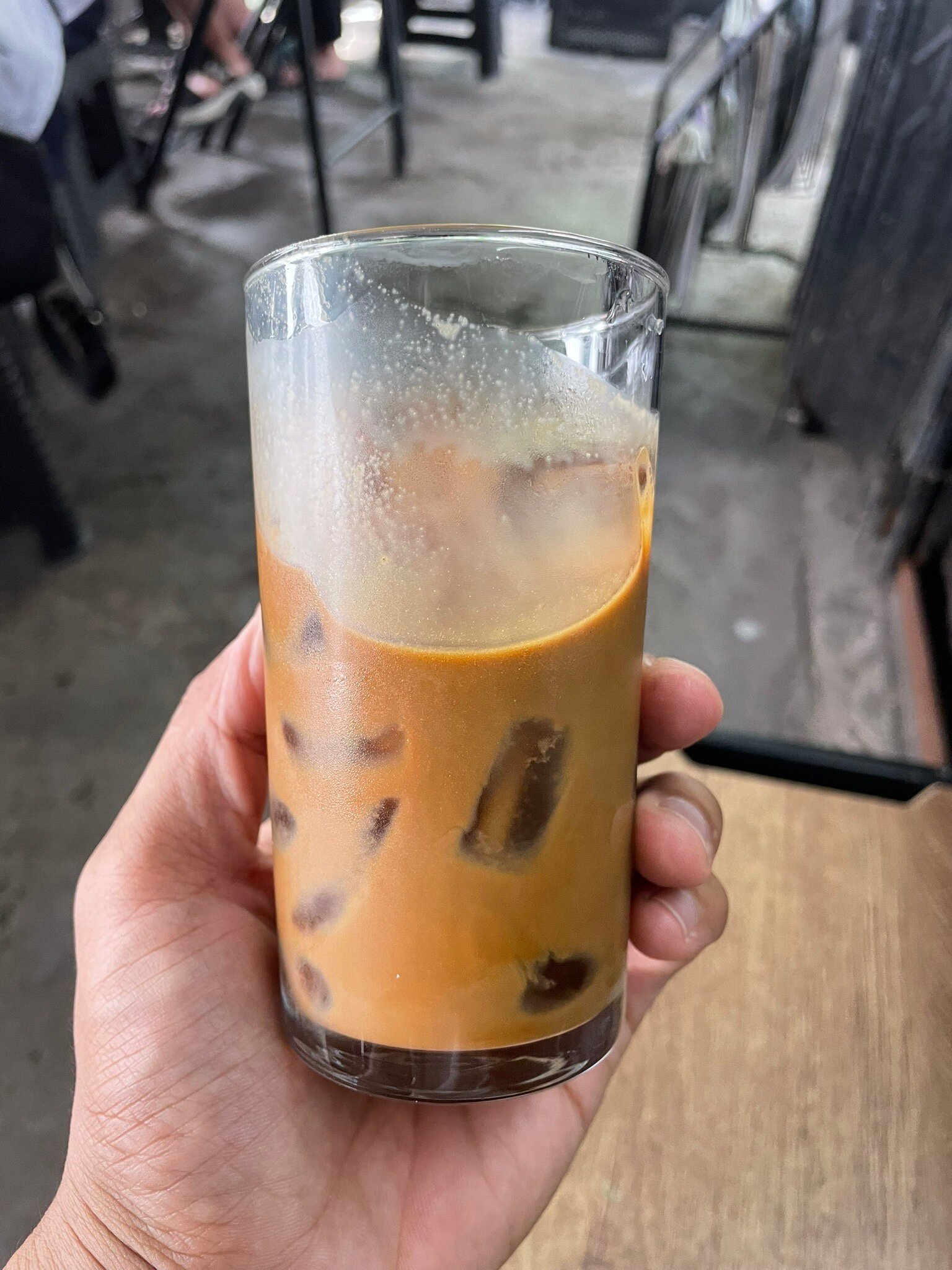 An iced coffee held at the venue