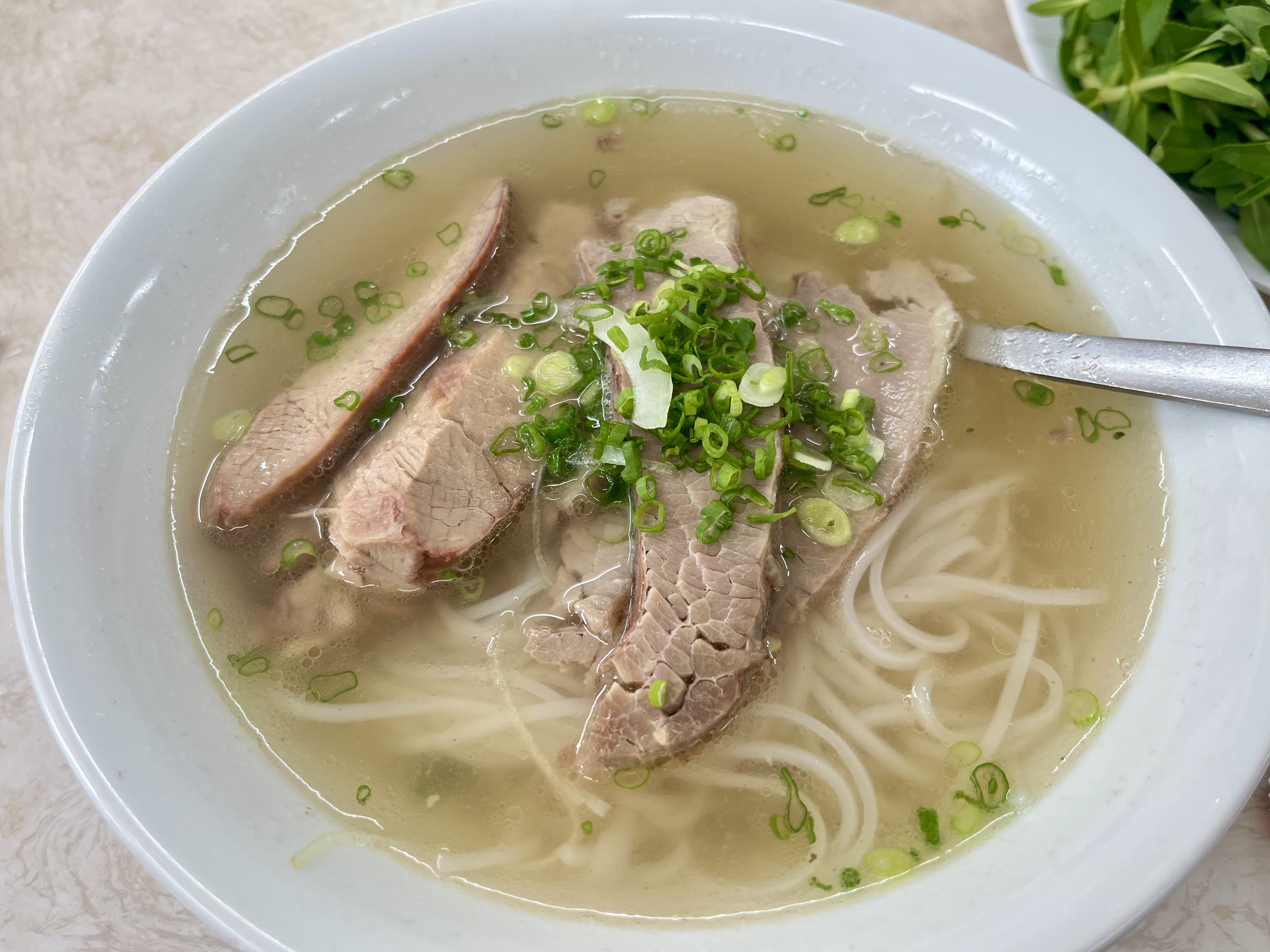 A beef-pho bowl at Pho Hoa Pasteur