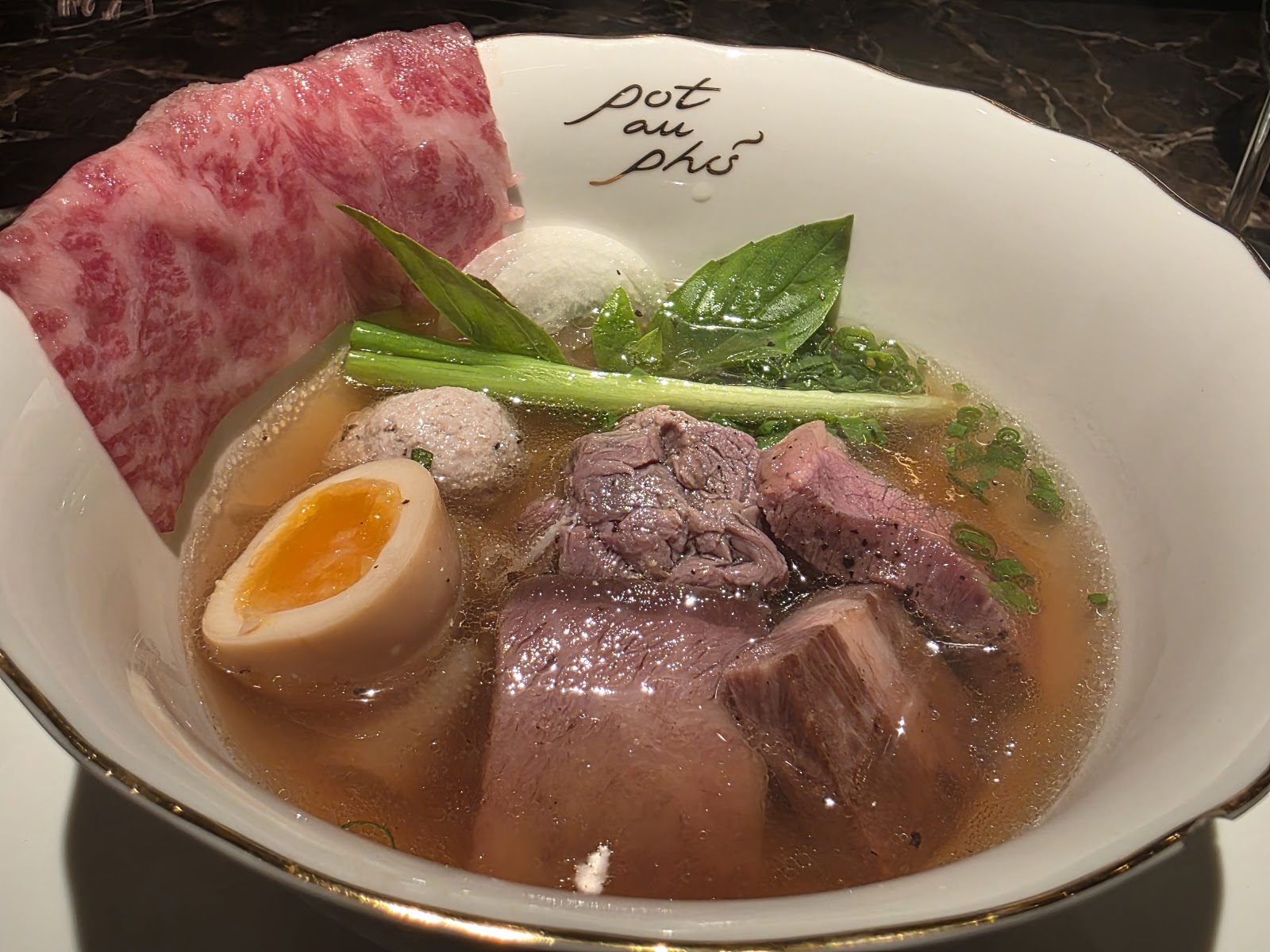 Full phở bowl with wagyu, meatballs and soft egg