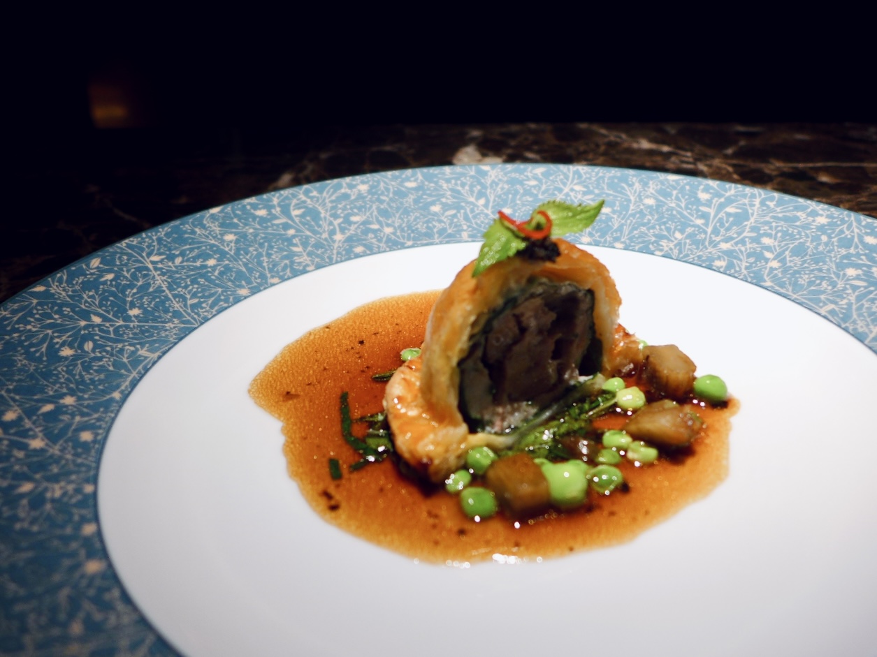 Pastry-wrapped course with jus