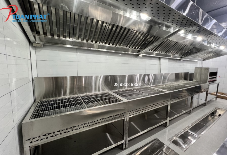 The stainless grill line and ceiling smoke-extraction system