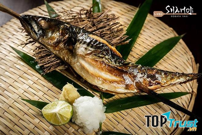 Whole grilled mackerel pike with the Shamoji logo