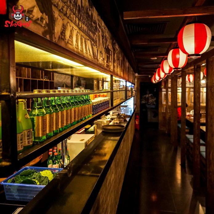The red-and-white paper-lantern corridor