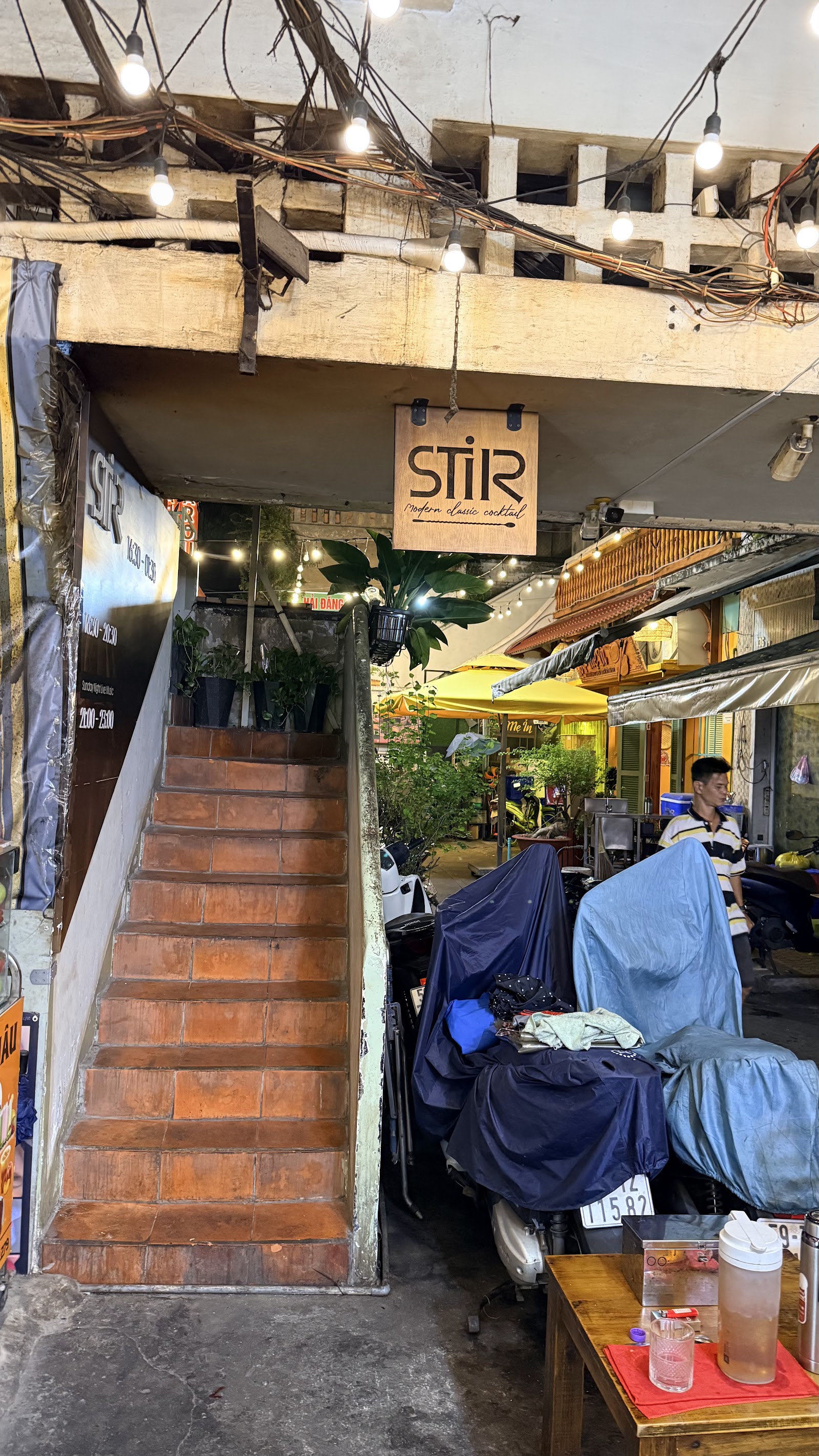 The stairway and wooden STIR sign in the alley
