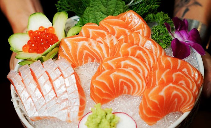 Salmon sashimi and white fish with ikura over crushed ice