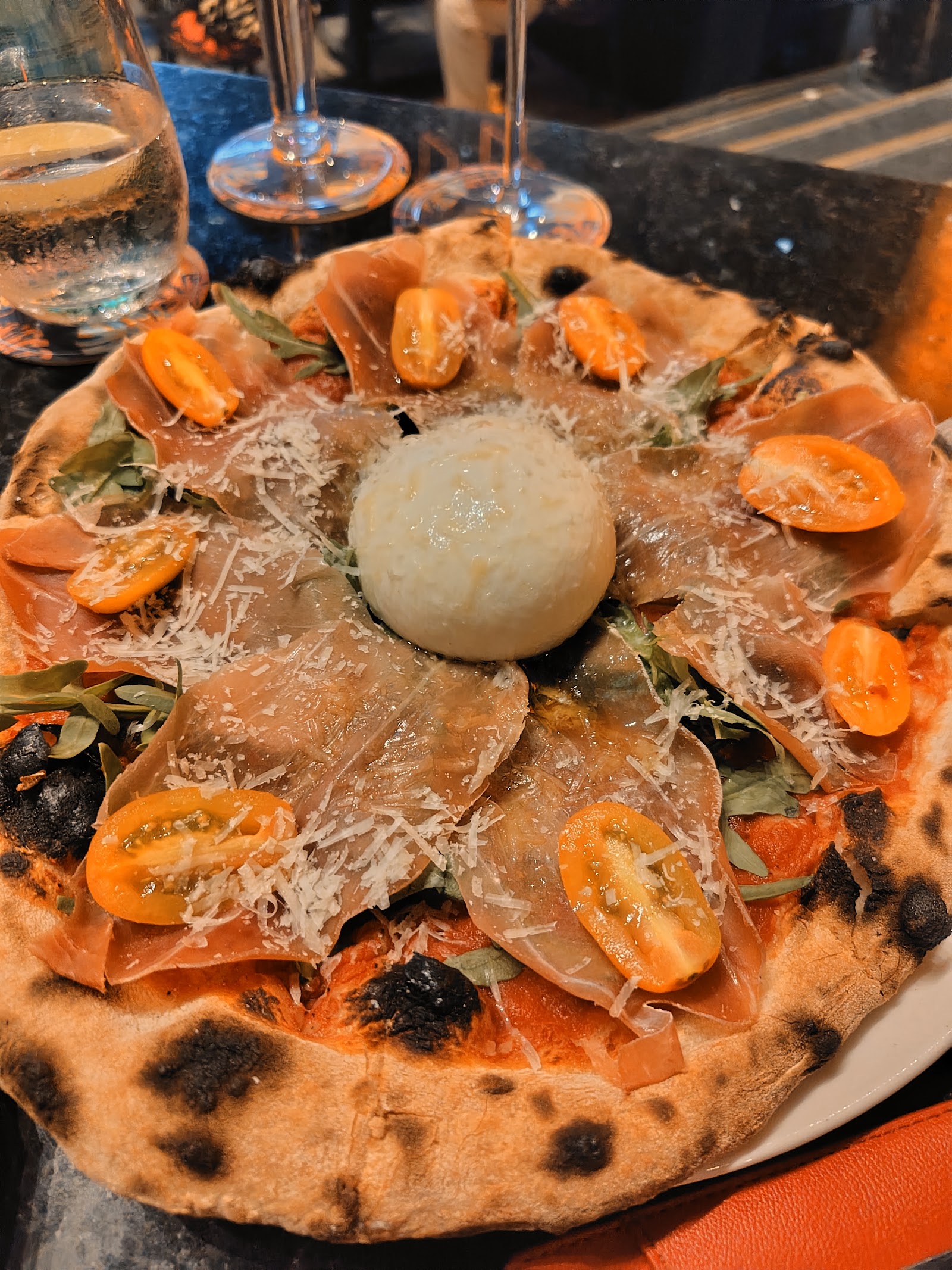 Prosciutto pizza with burrata from the wood-fired oven