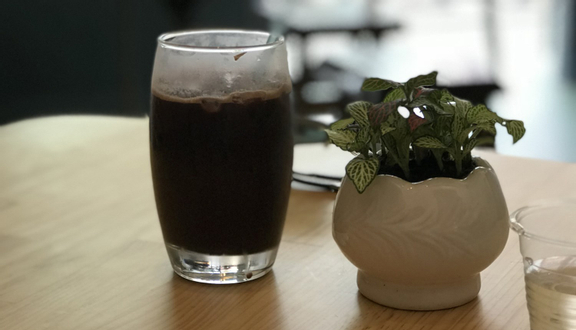Iced black coffee from Thuận Cà Phê on a wooden table