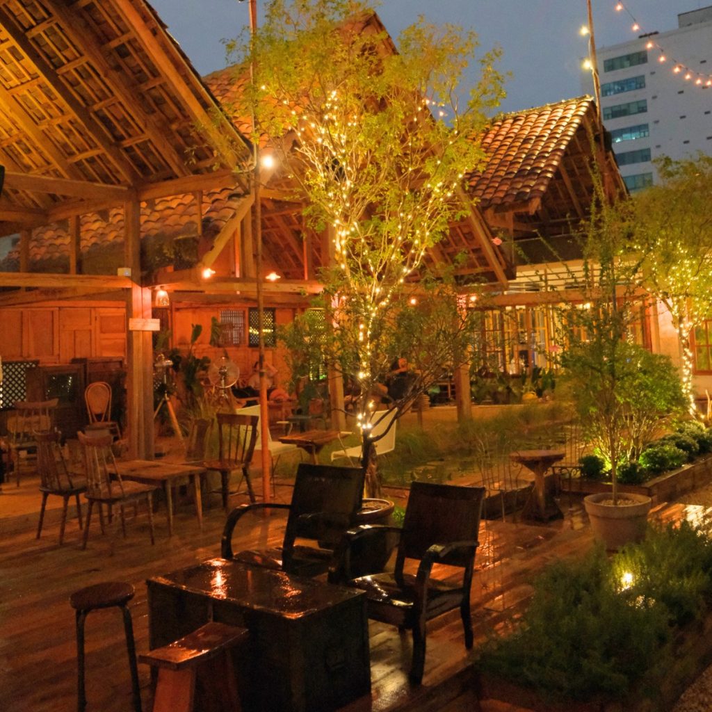 The wooden deck at night under old roof tiles