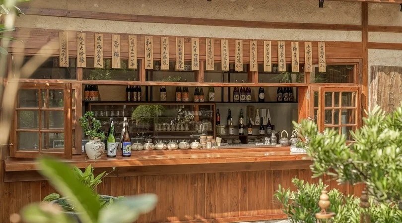 Yen's sake bar with rows of wooden plaques overhead